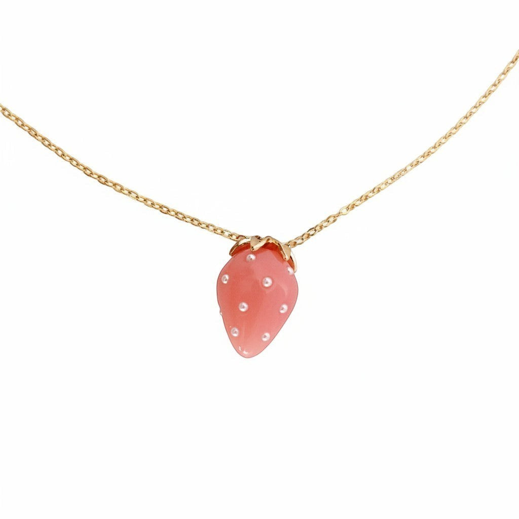 ZOA HANDMADE powder pink strawberry pendant necklace with pearl seeds and gold stem on a stainless steel chain.