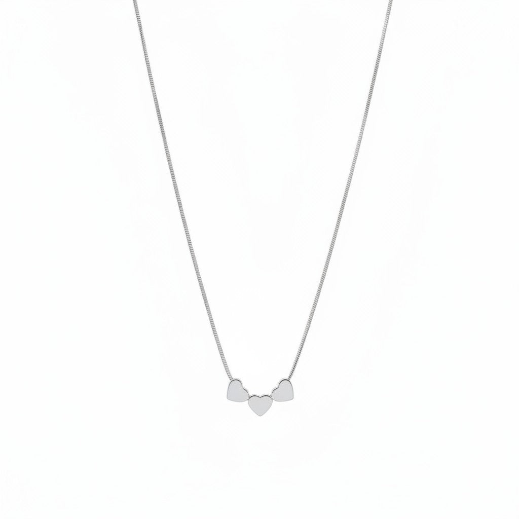 ZOA HANDMADE gold-plated stainless steel necklace with three small heart charms on a snake chain.